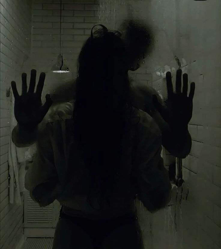 Two lovers silhouetted behind a fogged shower glass — hands pressed against the wall, bodies close, capturing the tension of anticipation and slow, mindful pleasure