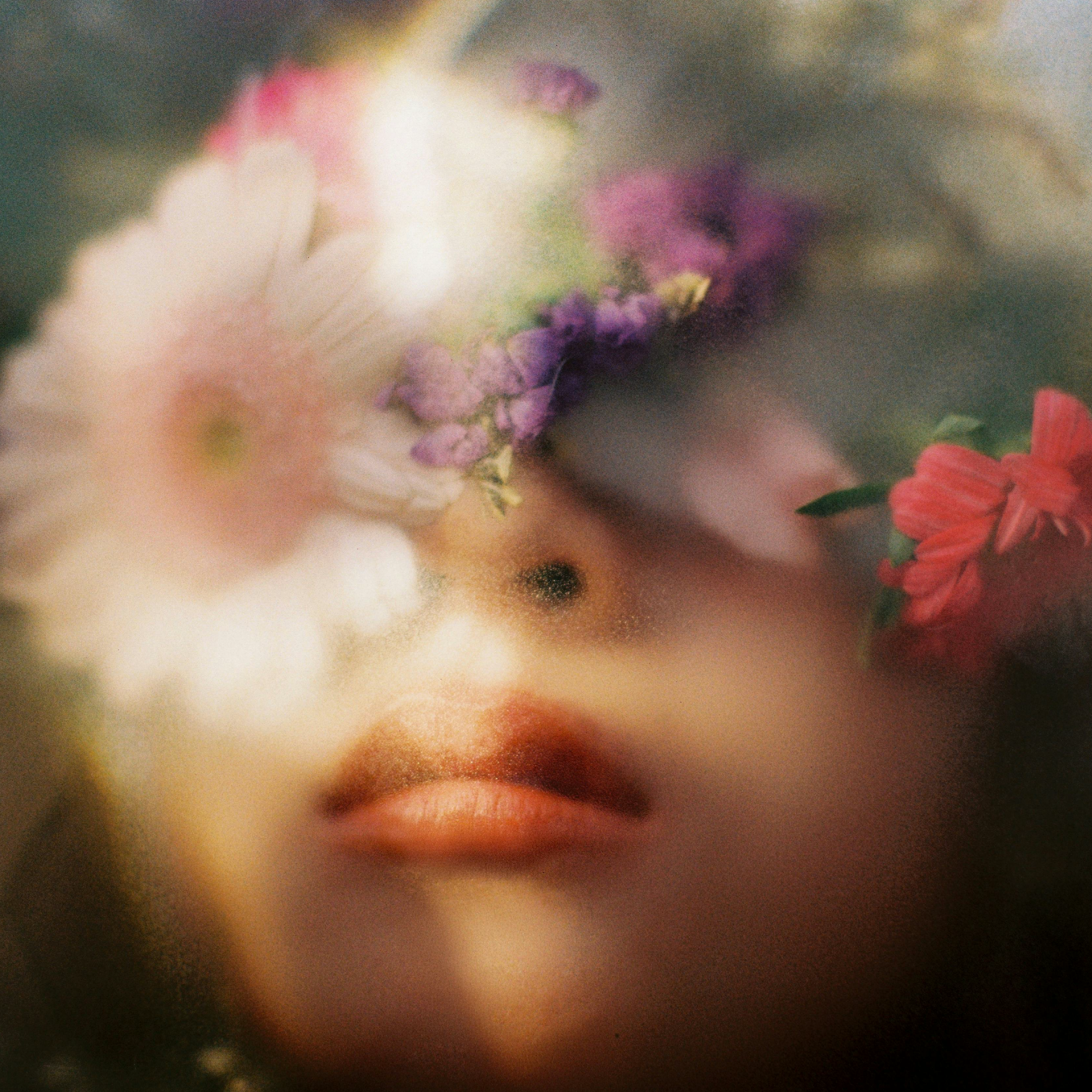 A serene and sensual scene of a woman relaxing in soft lighting, symbolizing intimate self-care and emotional wellbeing.